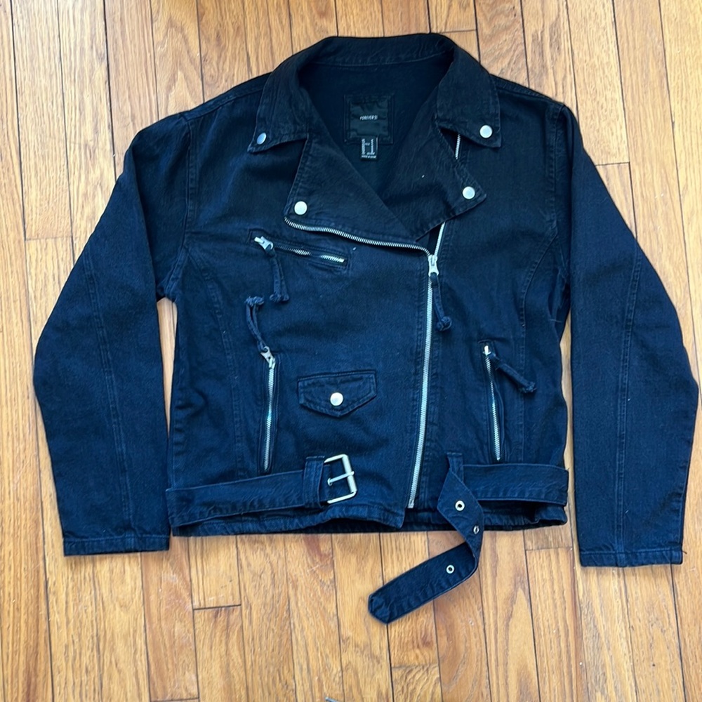 A lightly faded black bean jacket Diagonal zip.